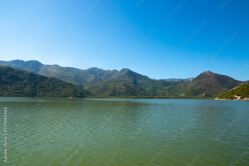 Mountains of Skadar Lake, Montenegro, beautiful landscapes of mountain green ranges from the water