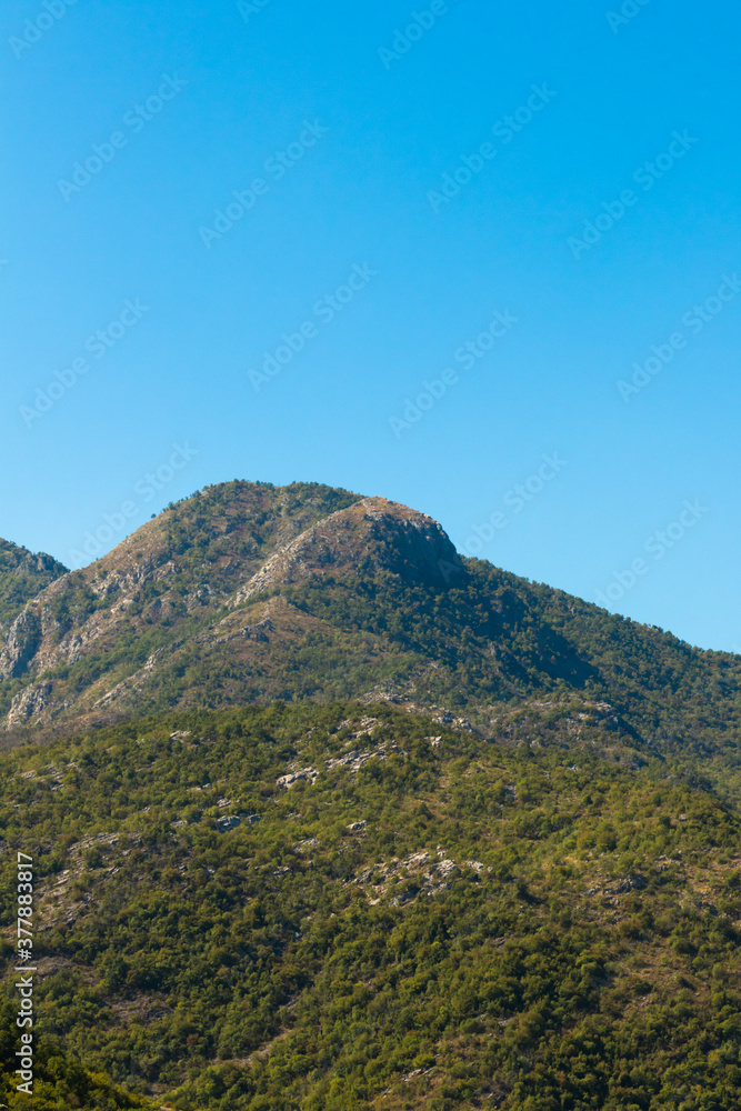 Vertical photos of mountain peaks in Montenegro