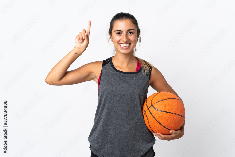 Young hispanic woman playing basketball over isolated white background pointing up a great idea Young hispanic woman playing basketball over isolated white background pointing up a great idea