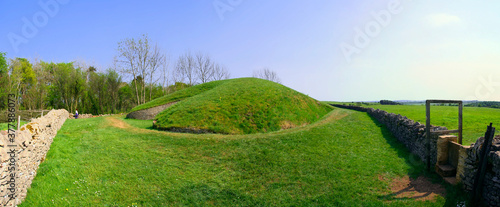 Belas Knap is a neolithic, chambered long barrow situated on Cleeve Hill, near Cheltenham and Winchcombe, in Gloucestershire, England. photo