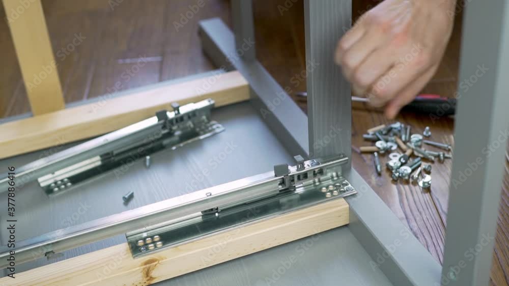 Carpentry Assembly Professional Worker Carpenter Furniture Assembler Checks The Work of A ...