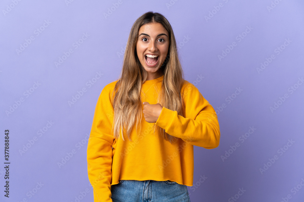 Young hispanic woman over isolated purple background with surprise facial expression Young hispanic woman over isolated purple background with surprise facial expression