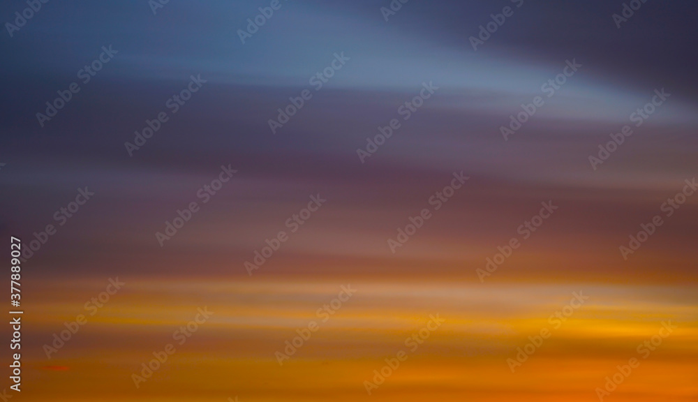    Abstract orange yellow blue background. The sky at sunset. Colorful banner. Golden sunset background with copy space for your design.    