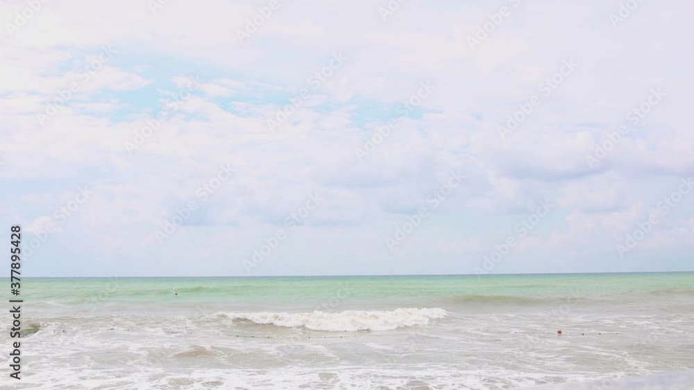 Stormy day by the sea. Seashore on an autumn day. Moving surface and sea waves in stormy weather. Stormy day by the sea. Seashore on an autumn day. Moving surface and sea waves in stormy weather.
