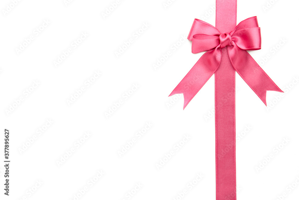 Pink ribbon with bow isolated on a white background. Pink ribbon with bow isolated on a white background.