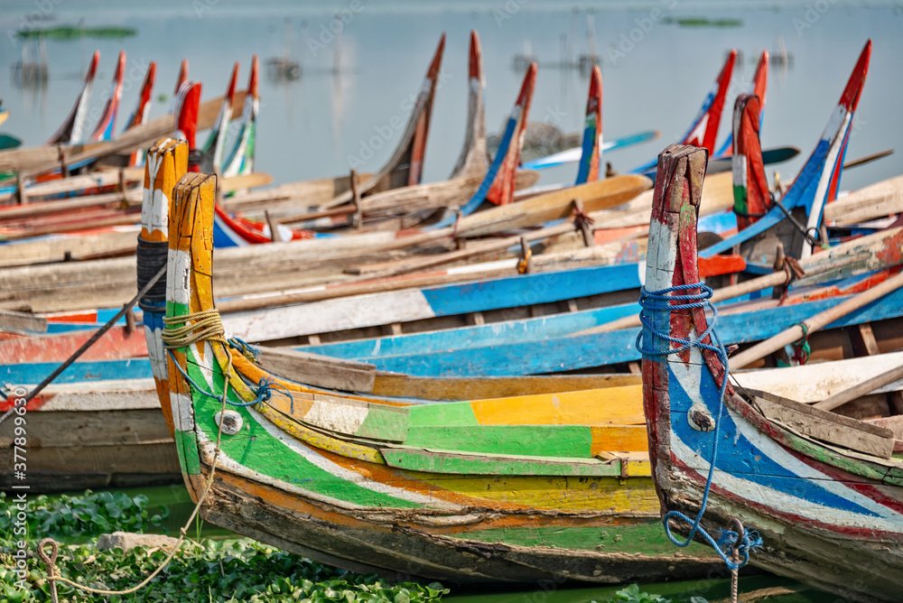 Colorful traditional wooden row boats in Amapura, near U Bein bridge, Mandalay, Burma Myanmar Colorful traditional wooden row boats in Amapura, near U Bein bridge, Mandalay, Burma Myanmar
