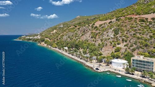 Aerial drone photo of famous seaside area, organised beach and bay of Loutraki town, Corinthian bay, Greece