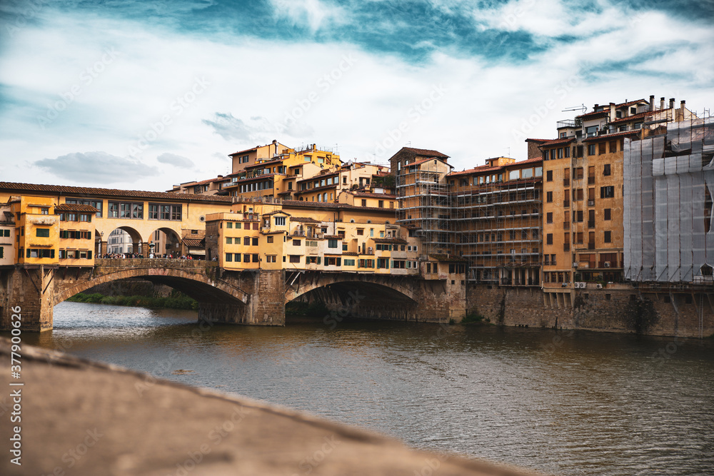 Ponte Vecchio - medieval stone segmental arch bridge in Florence, Italy. Ponte Vecchio - medieval stone segmental arch bridge in Florence, Italy.