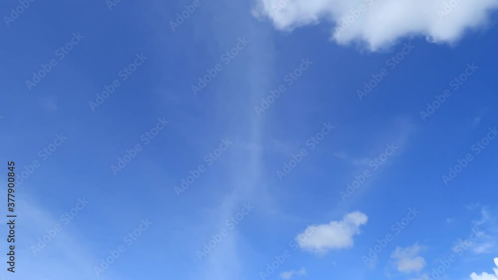 White & dark grey cloud or fluffy cumulus cloudscape on Beautiful sunny clear blue sky background before thunder rain storm or hurricane in tropical summer sunlight & sun ray at sunshine day TimeLapse White & dark grey cloud or fluffy cumulus cloudscape on Beautiful sunny clear blue sky background before thunder rain storm or hurricane in tropical summer sunlight & sun ray at sunshine day TimeLapse