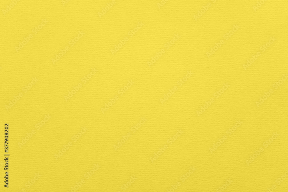 Fashionable pantone color of the year 2021 illuminating. Texture of illuminating colored paper for watercolor and pastel. Modern luxury background or mock up, copy space Fashionable pantone color of the year 2021 illuminating. Texture of illuminating colored paper for watercolor and pastel. Modern luxury background or mock up, copy space