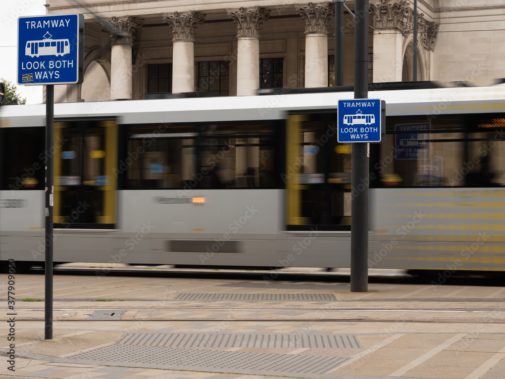 A Tram moves through St Peters Square in Manchester City Centre