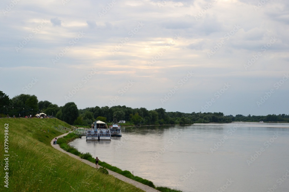 Kazimierz Dolny, Poland.  Promenade on the banks of Vistula river. Popular place for tourists
