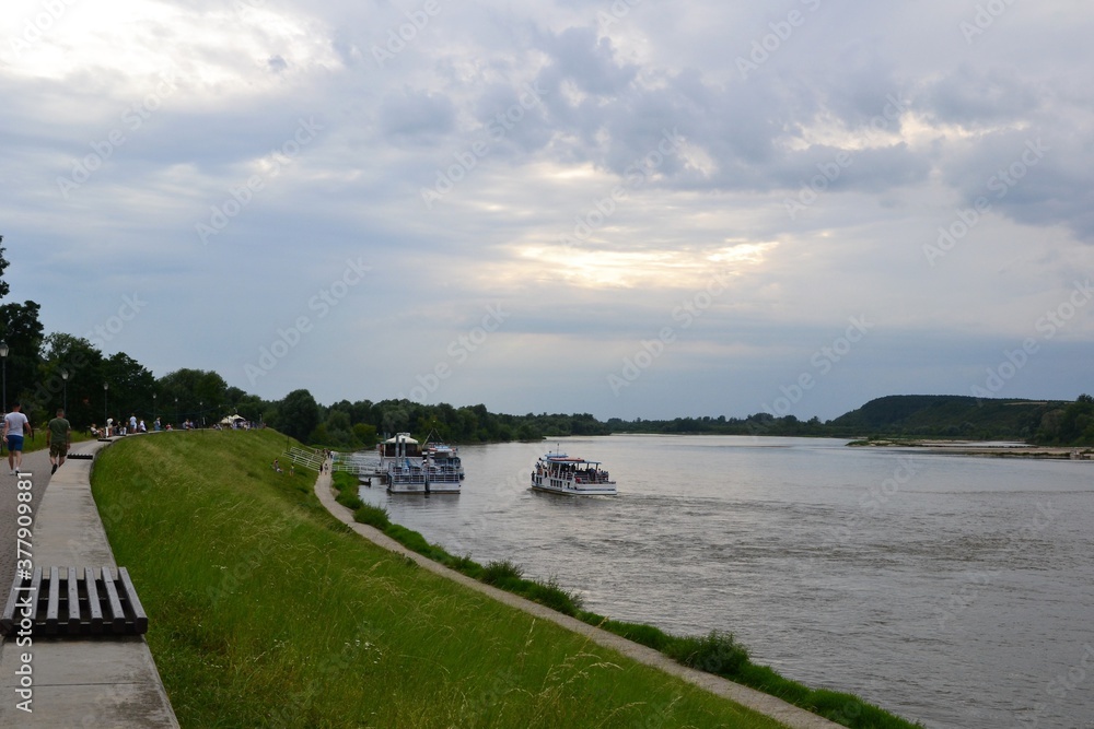 Fototapeta premium Kazimierz Dolny, Poland. Promenade on the banks of Vistula river. Popular place for tourists