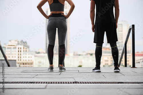 Athletic couple during workout in city centre