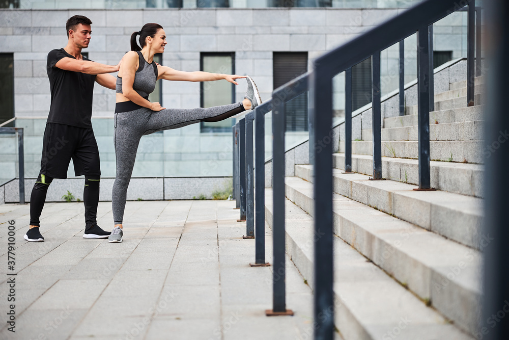 Happy young woman enjoying workout with boyfriend Happy young woman enjoying workout with boyfriend
