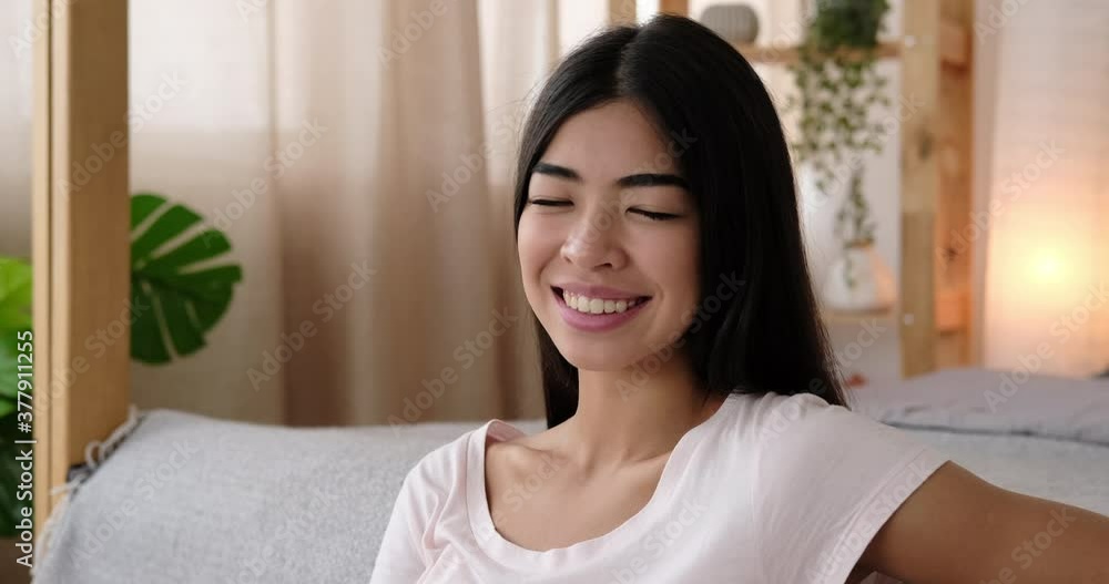 Beautiful korean woman smiling at home