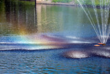 fountain on the river. Rainbow around the jets. Riga, Latvia.
