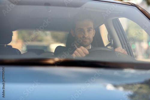 Wallpaper Mural Young man driving his car to work in the city Torontodigital.ca