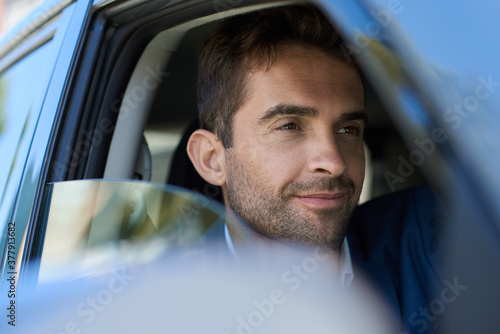 Young man sitting in his car during his morning commute