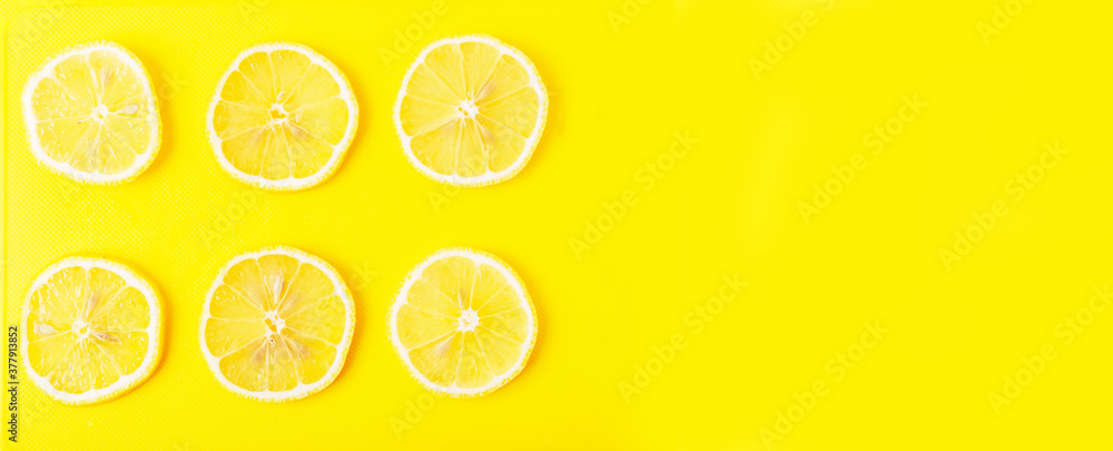 Lemon slices on a yellow Board close up Lemon slices on a yellow Board close up