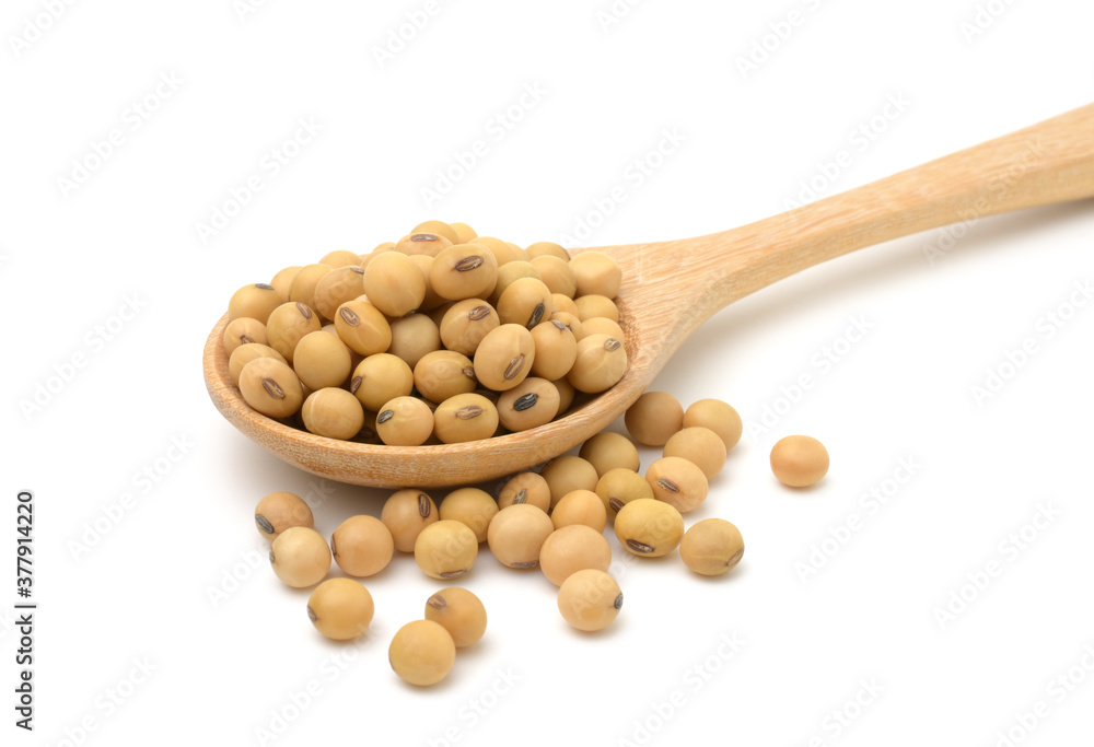 Soybeans in a wooden spoon isolated on white background. Soybeans in a wooden spoon isolated on white background.