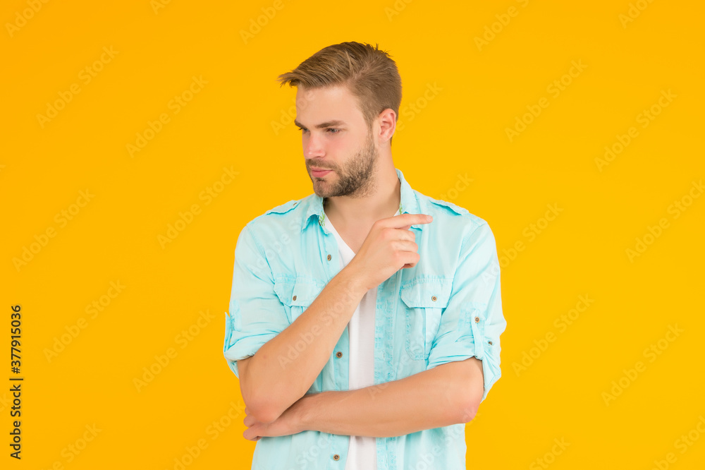 Cool and sexy. bearded sexy man wearing casual shirt. male spring fashion style. mens facial care and beauty. having trendy haircut. pensive guy with unshaven face. posing fashion model Cool and sexy. bearded sexy man wearing casual shirt. male spring fashion style. mens facial care and beauty. having trendy haircut. pensive guy with unshaven face. posing fashion model