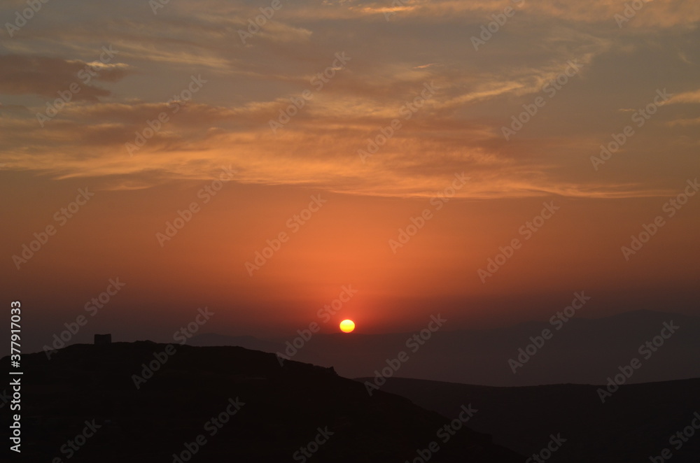 Obraz premium sunset over the mountains in Greece
