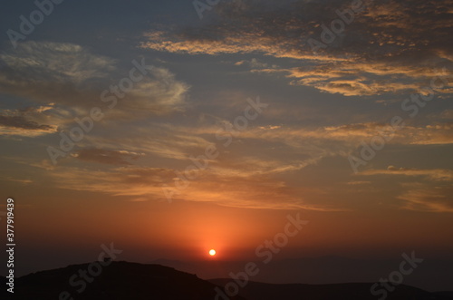 sunset in the sky in Greece