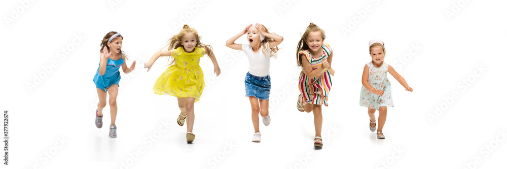 Happy children, little and emotional caucasian kids jumping and running isolated on white background. Looks happy, cheerful, sincere. Copyspace for ad. Childhood, education, happiness concept. Happy children, little and emotional caucasian kids jumping and running isolated on white background. Looks happy, cheerful, sincere. Copyspace for ad. Childhood, education, happiness concept.