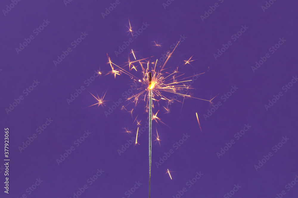 Obraz premium Bengal fire on a colored background. 