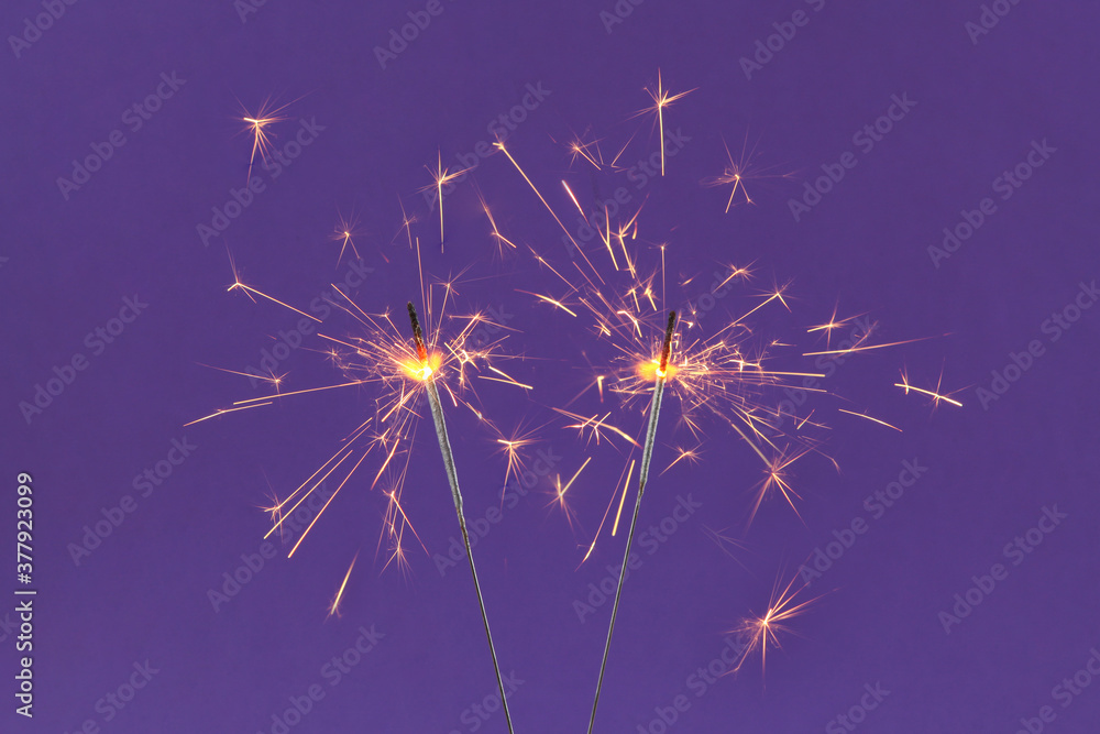 Obraz premium Bengal fire on a colored background. 