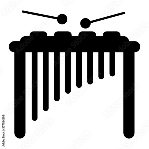 
Percussion instrument consisting of a series of graduated wooden bars, xylophone 
