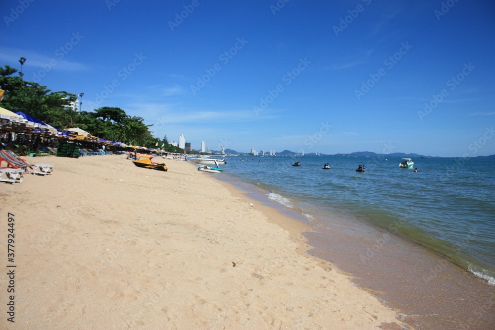 Beautiful view of the beach and blue sky with green trees Beautiful view of the beach and blue sky with green trees
