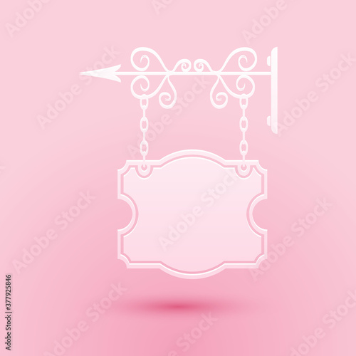 Paper cut Vintage street signboard hanging on forged brackets icon isolated on pink background. Suitable for advertisements bar, cafe, pub, restaurant. Paper art style. Vector.