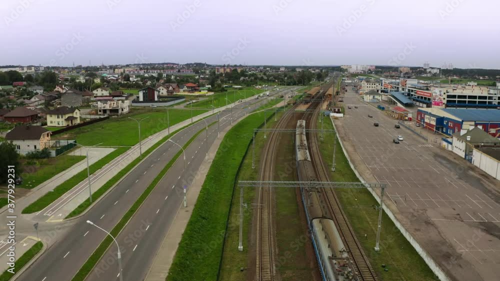 City electric train travels in the city. View from the drone. City electric train travels in the city. View from the drone.