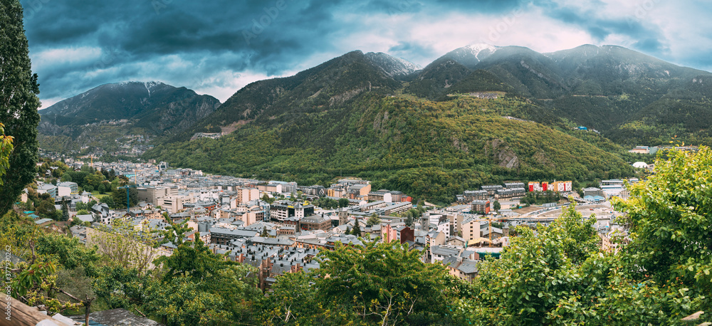 Andorra, Principality Of The Valleys Of Andorra. Top Panoramic View Of Cityscape In Summer Season. City In Pyrenees Mountains Andorra, Principality Of The Valleys Of Andorra. Top Panoramic View Of Cityscape In Summer Season. City In Pyrenees Mountains