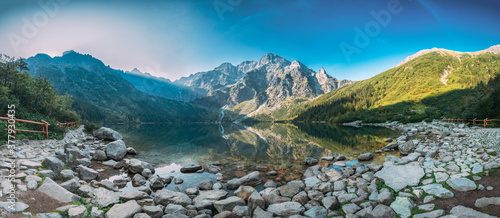 Fototapeta Naklejka Na Ścianę i Meble -  Tatra National Park, Poland. Panorama Famous Mountains Lake Morskie Oko Or Sea Eye Lake In Summer Morning. Five Lakes Valley. Beautiful Scenic Viev