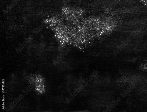 Abstract black background with white spots on old shabby black surface