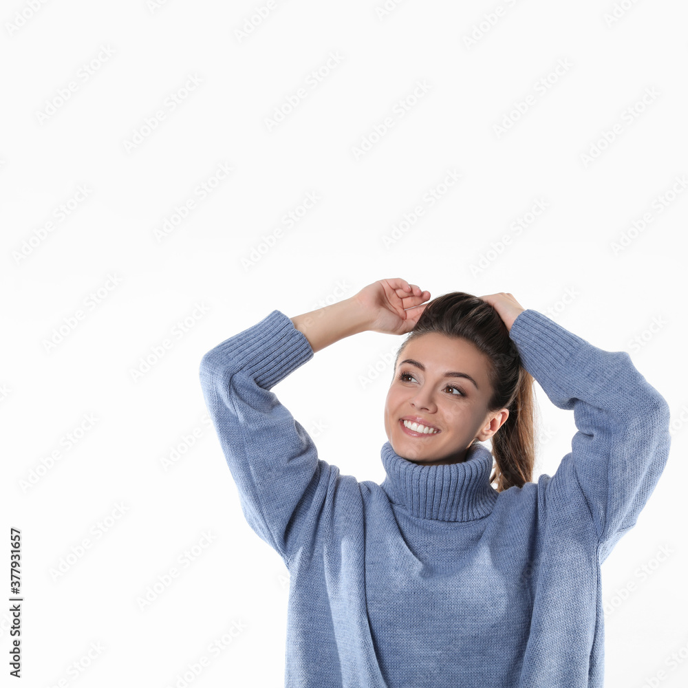 Young woman in stylish blue sweater on white background Young woman in stylish blue sweater on white background