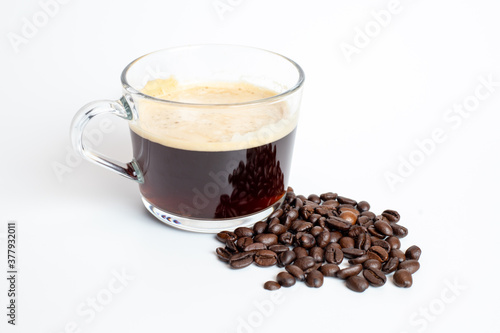 Fototapeta Naklejka Na Ścianę i Meble -  A glass of coffee grinder with coffee beans on white background
