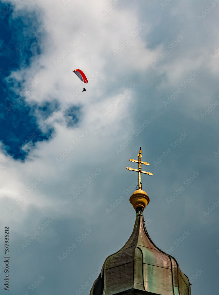 Details of the famous chapel at the Wallberg with a paraglider in the sky above near Tegernsee, Bavaria, Germany