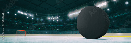 Canvas Print Sport indoor ice hockey arena with black puck on the ice rink as widescreen background