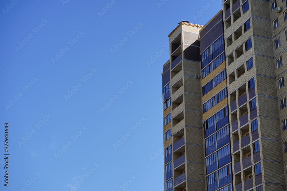 Modern apartment buildings on a sunny day with a blue sky. Facade of a modern apartment building. residential building modern apartment condominium architecture. Modern apartment buildings on a sunny day with a blue sky. Facade of a modern apartment building. residential building modern apartment condominium architecture.