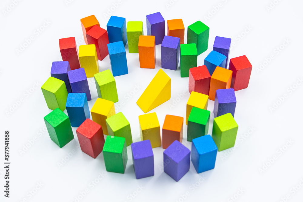 Obraz premium Untidy variety colorful blocks see sleep yellower block at white background