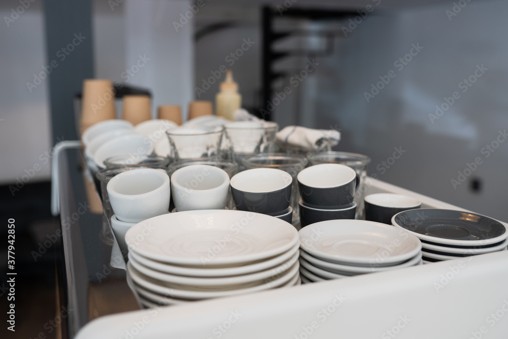 A kitchen countertop and a sink with dishes. A kitchen countertop and a sink with dishes.