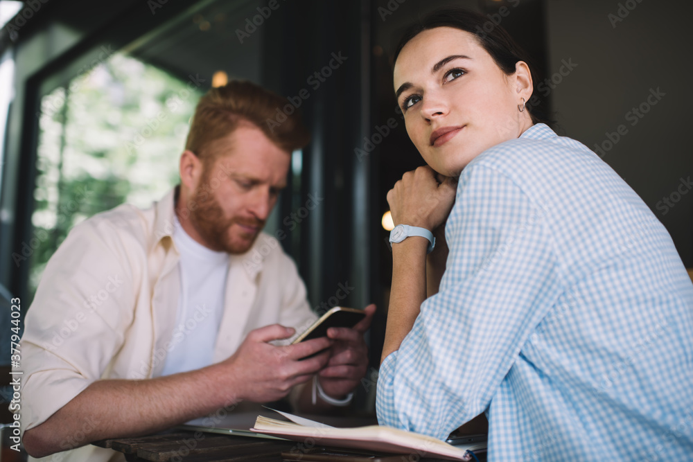 Woman sitting in cafe with colleague
