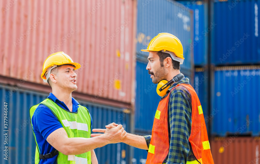 Engineer and foreman worker handshake with blurred construction site, Success and Teamwork concept Engineer and foreman worker handshake with blurred construction site, Success and Teamwork concept