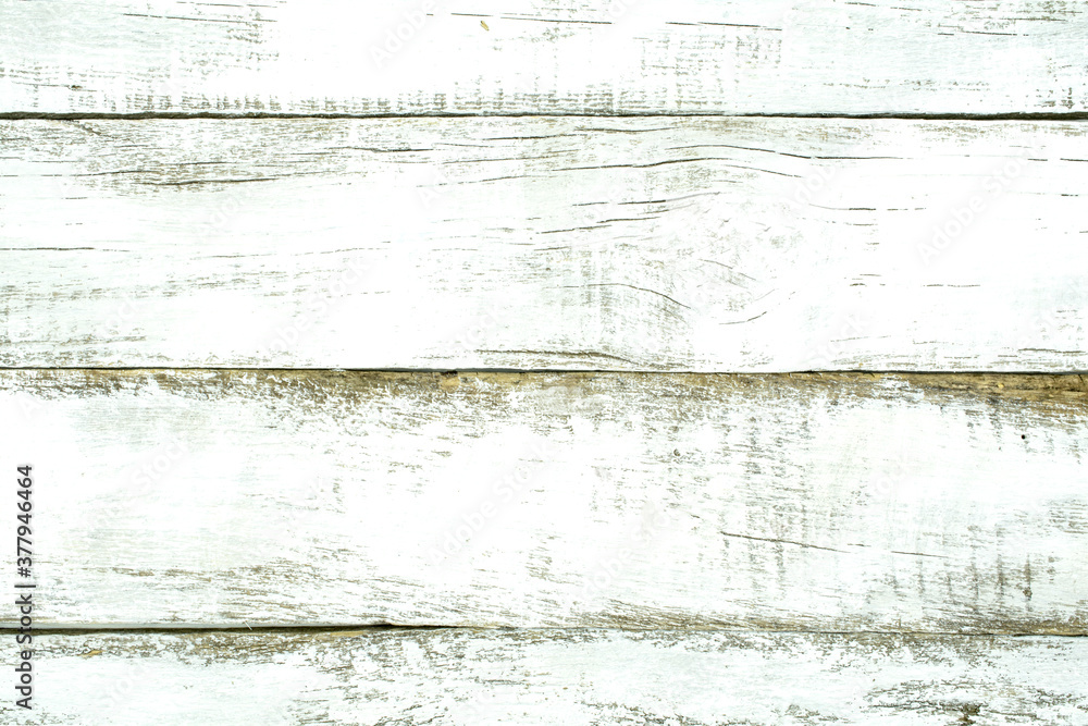 Obraz premium The texture of the old surface of white planks close-up as a background.