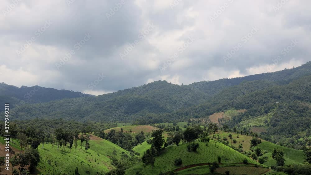 Time lapse of clouds and shadow passing over green valley and mountains before thunderstorm coming. Landscape time lapse. Time lapse of clouds and shadow passing over green valley and mountains before thunderstorm coming. Landscape time lapse.
