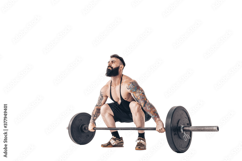 Φωτογραφία The technique of doing an exercise of deadlift with a barbell of a muscular strong tattooed bearded sports men on a white studio background